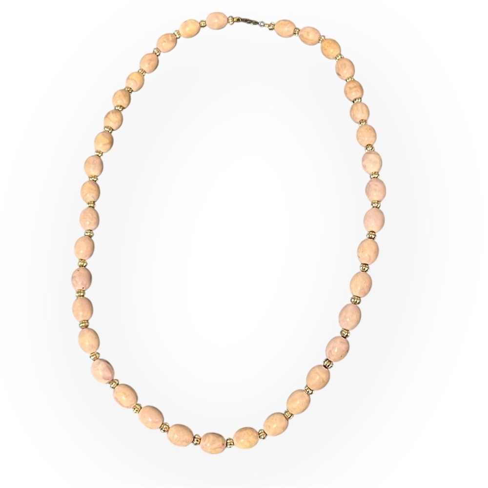 Long vintage strand faux angel skin coral beads, gold tone spacers necklace.